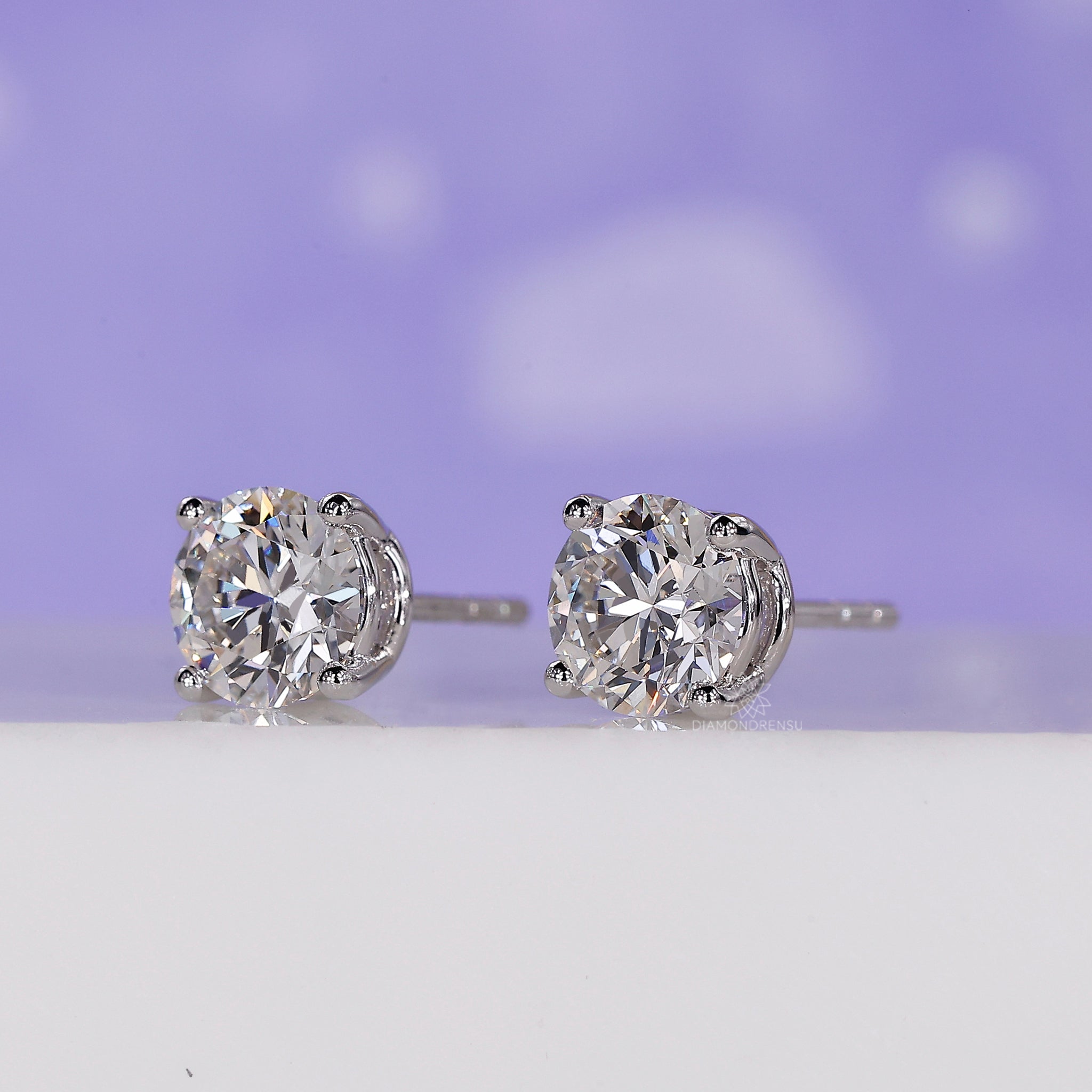 Handmade earrings in gold designed for women with lab grown round diamonds.
