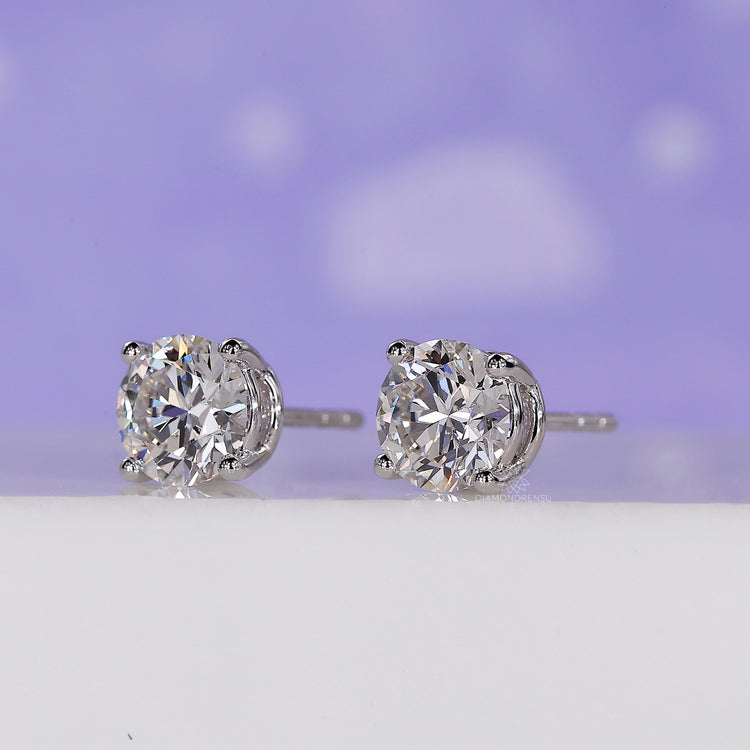 Handmade earrings in gold designed for women with lab grown round diamonds.