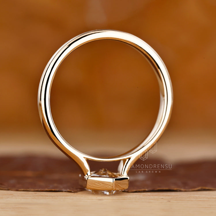 Handmade ring featuring hexagon cut diamond.
