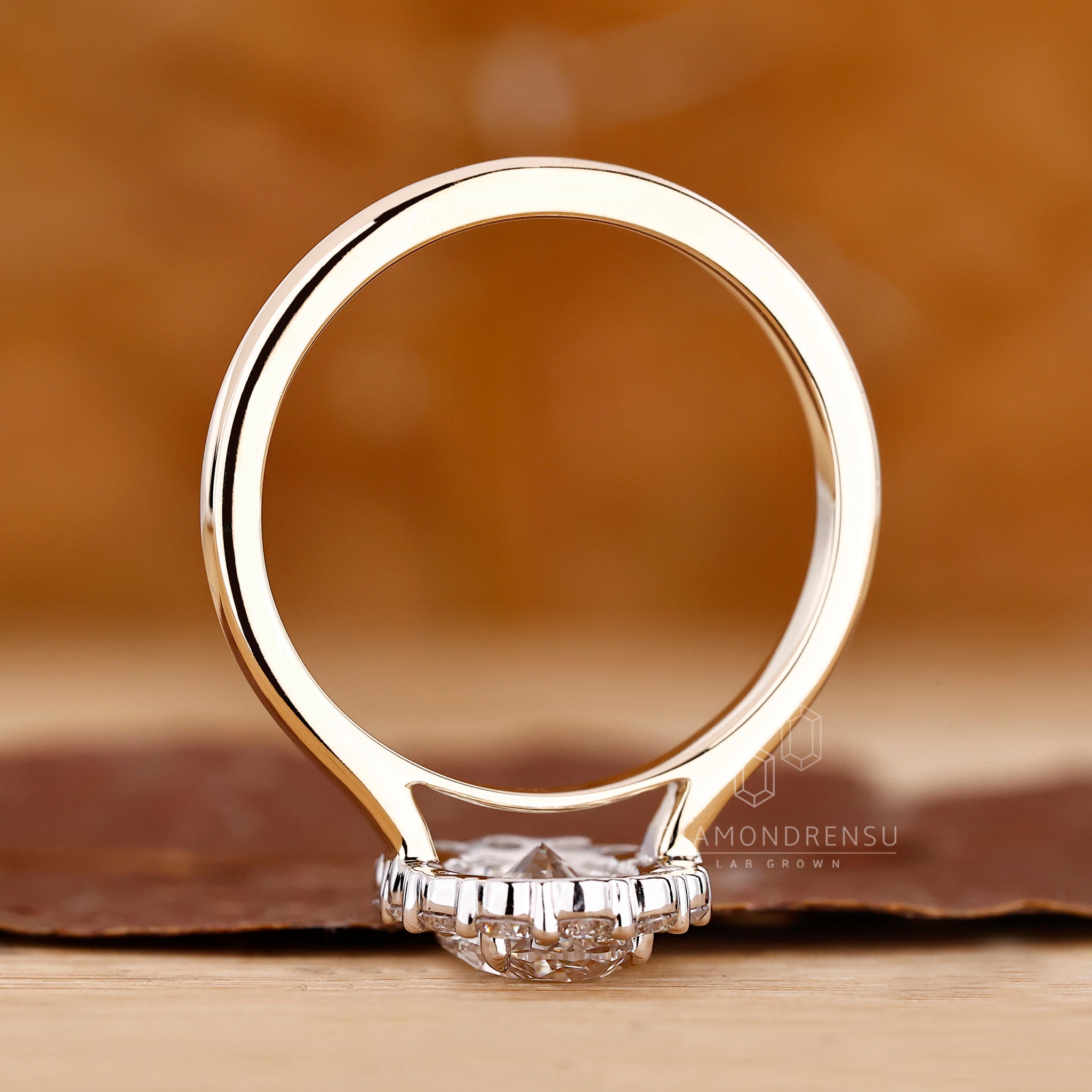 Unique ring with oval center and round halo accents.
