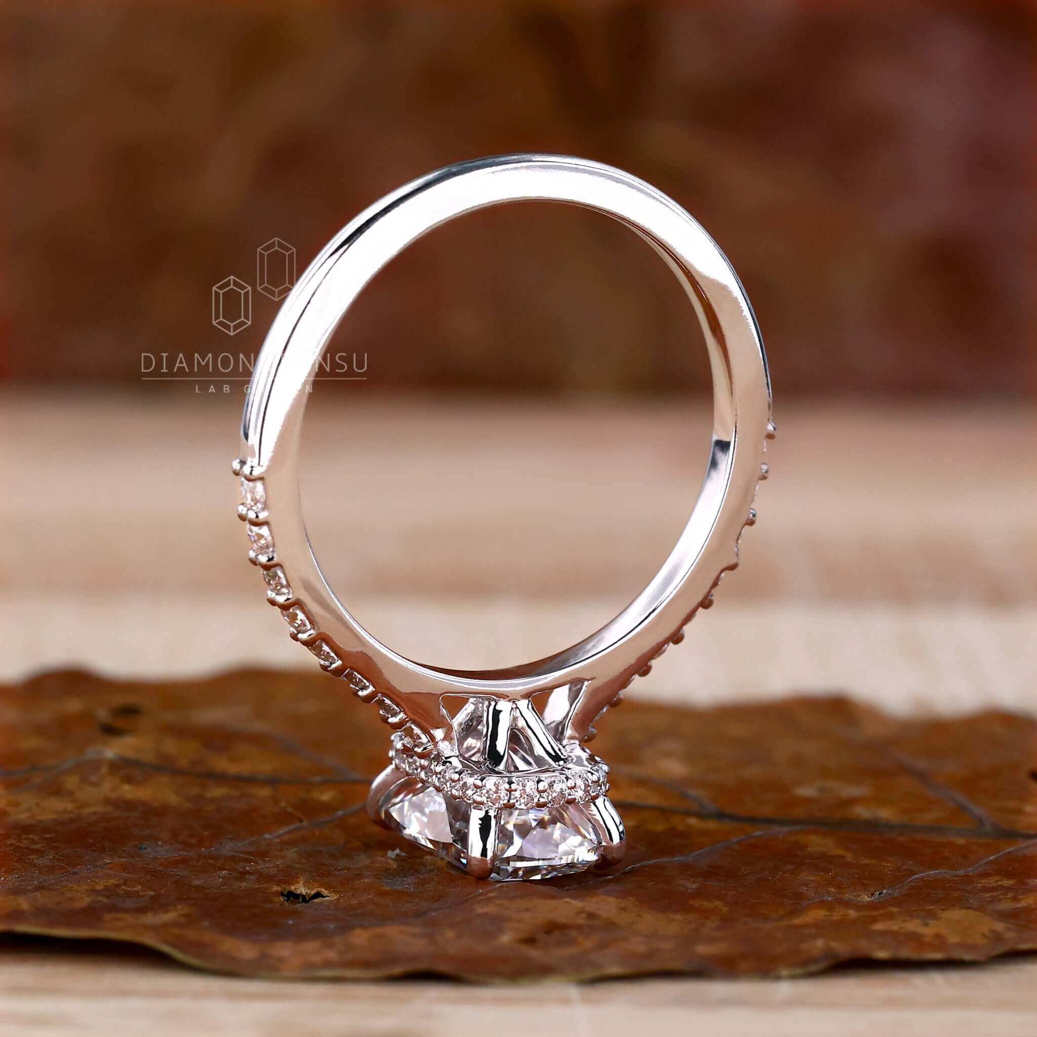 Engagement ring hidden halo featuring a cushion cut ring diamond for added brilliance.