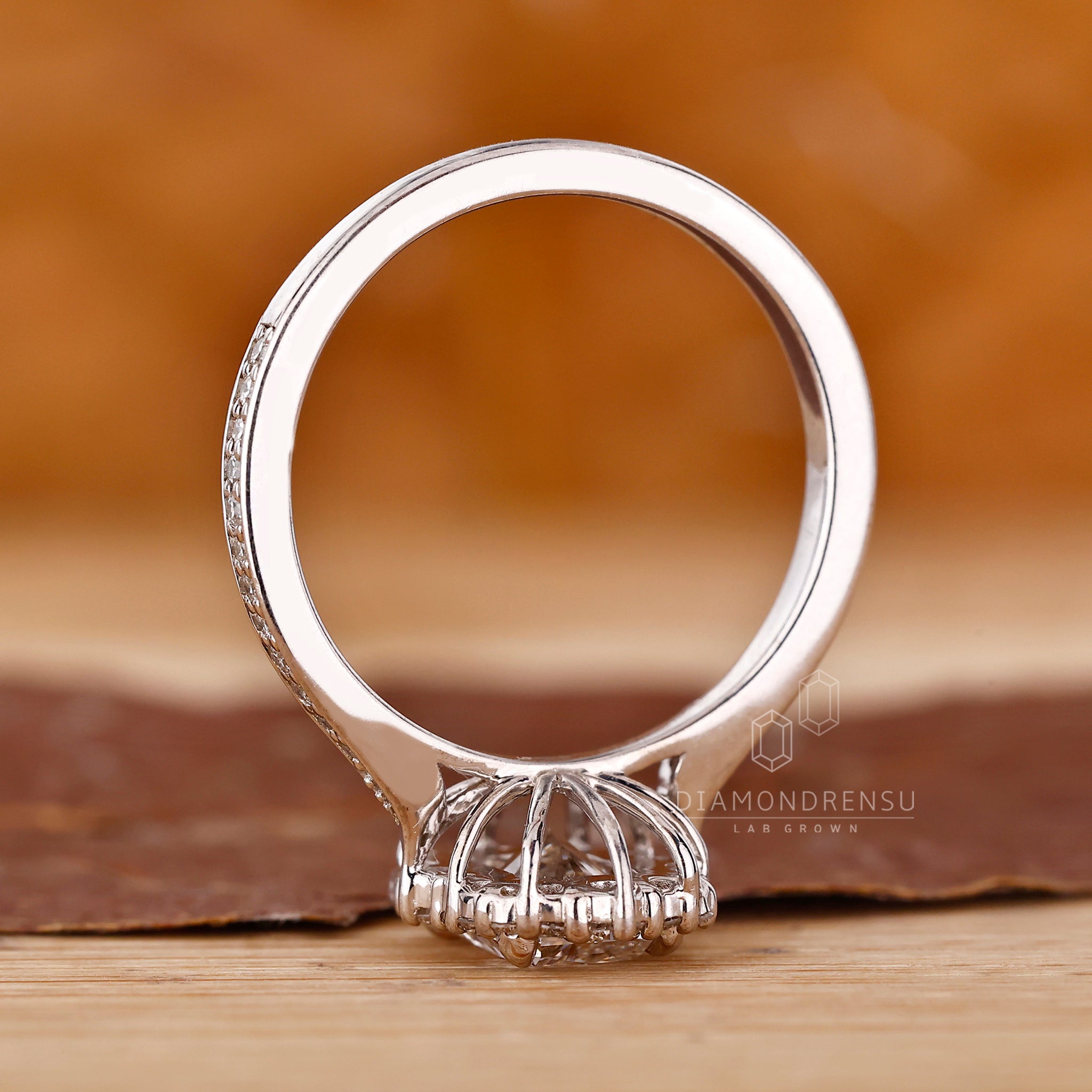 UK engagement ring with cathedral and tapered shank.
