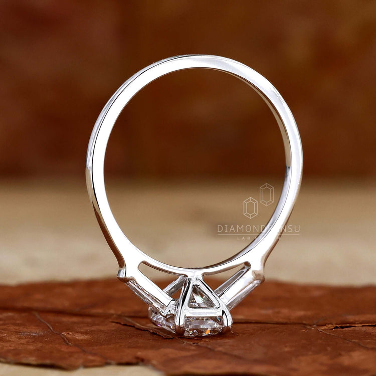 Radiant cut engagement ring paired with a baguette diamond ring.
