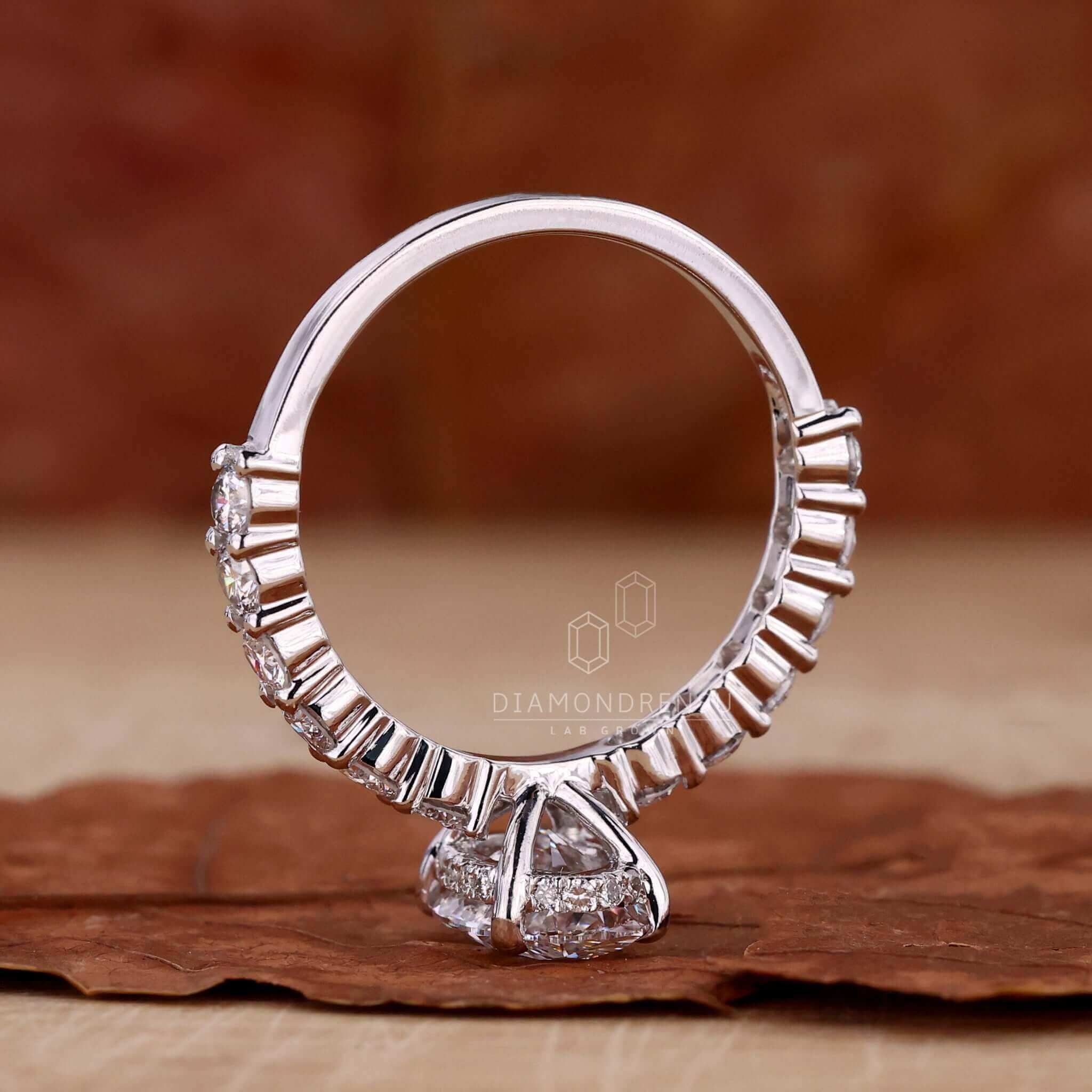 Hidden halo ring showcasing a brilliant oval diamond in handmade jewellery.