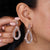 Teardrop shape earrings crafted in rose gold.

