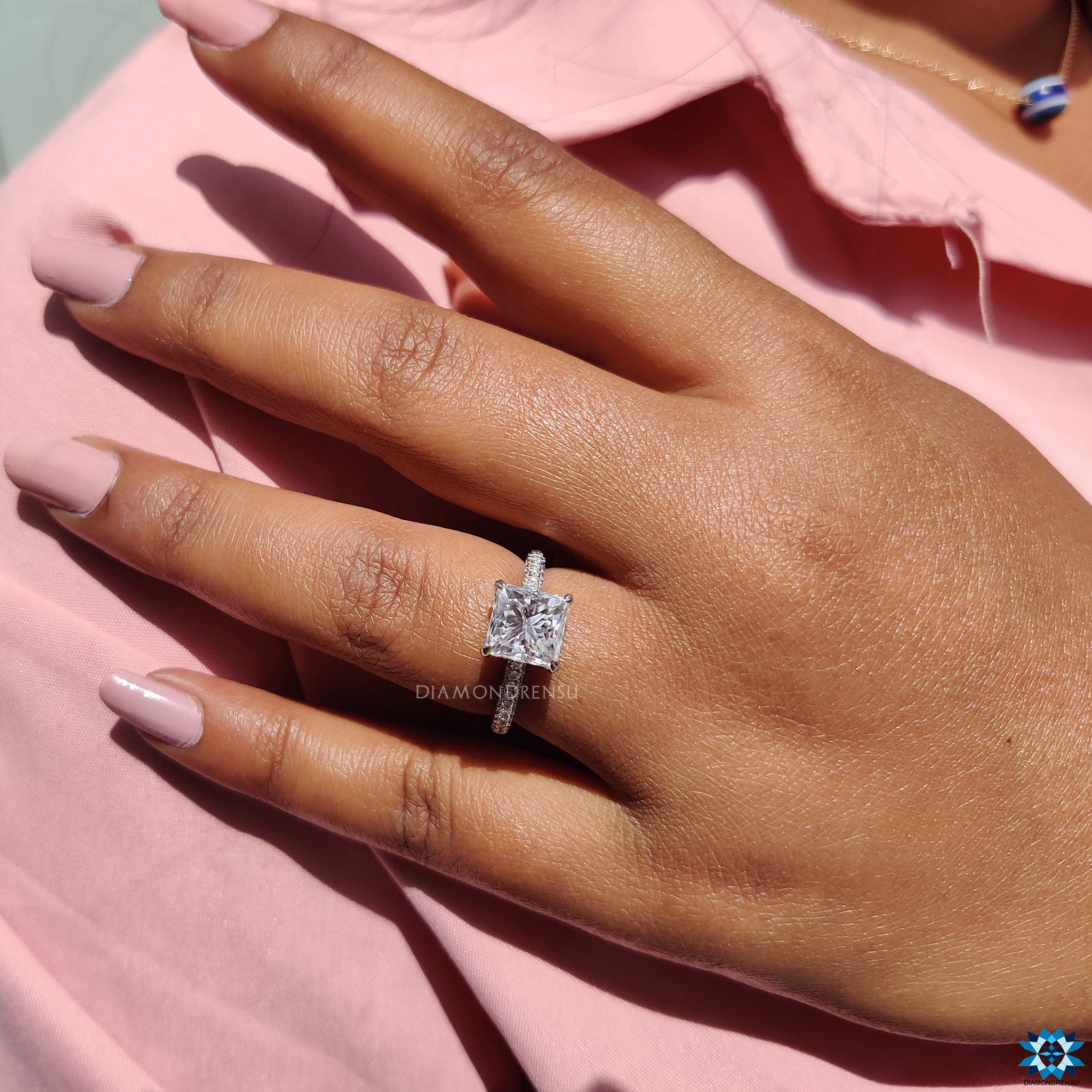 3 sided pave engagement ring with hidden accents and round pave band.

