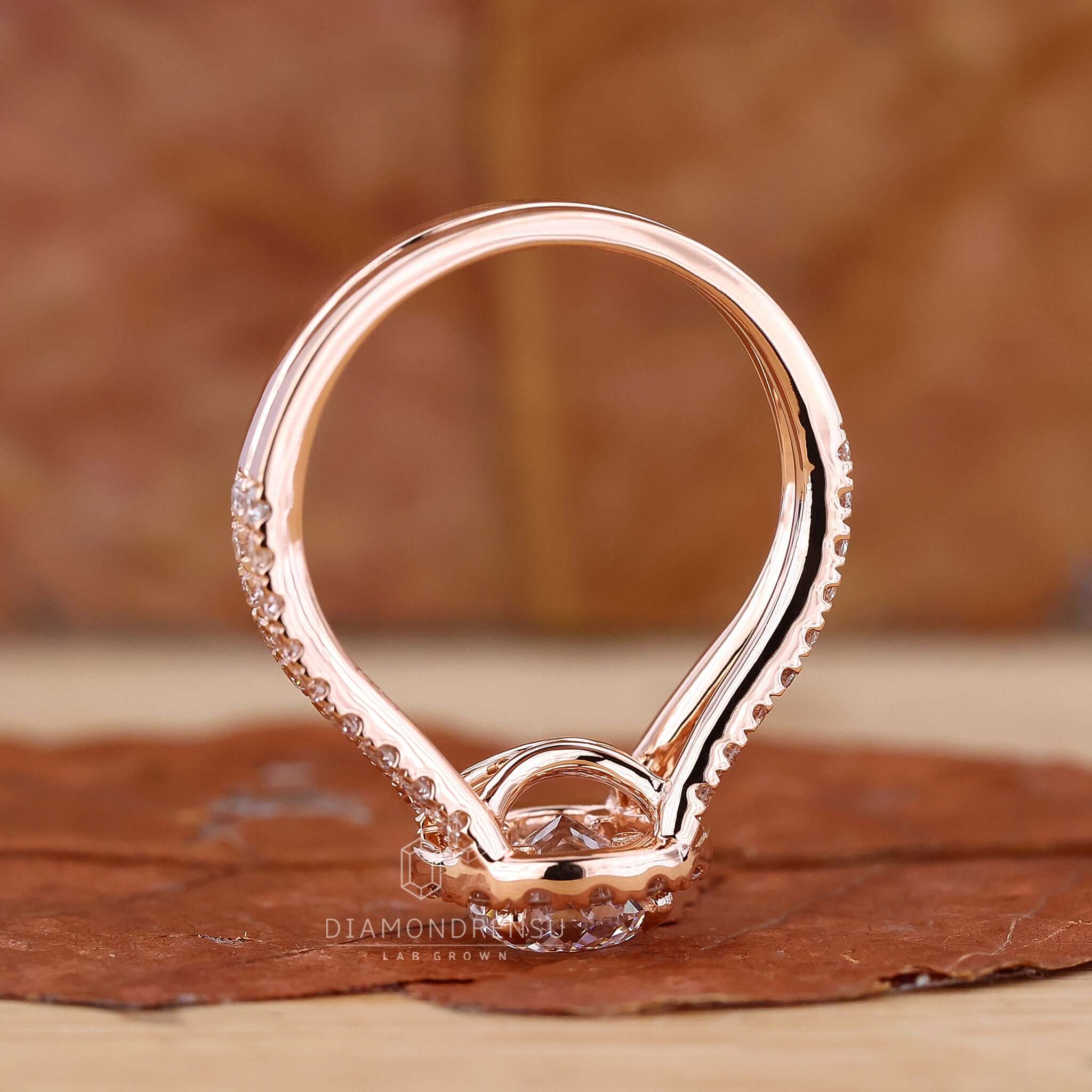 Elegant halo engagement ring on a white backdrop