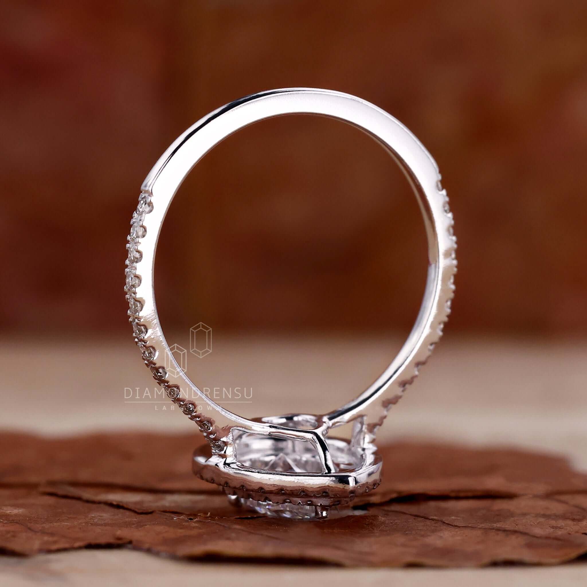 Double halo ring showcasing a pear shaped diamond for a unique engagement ring style.