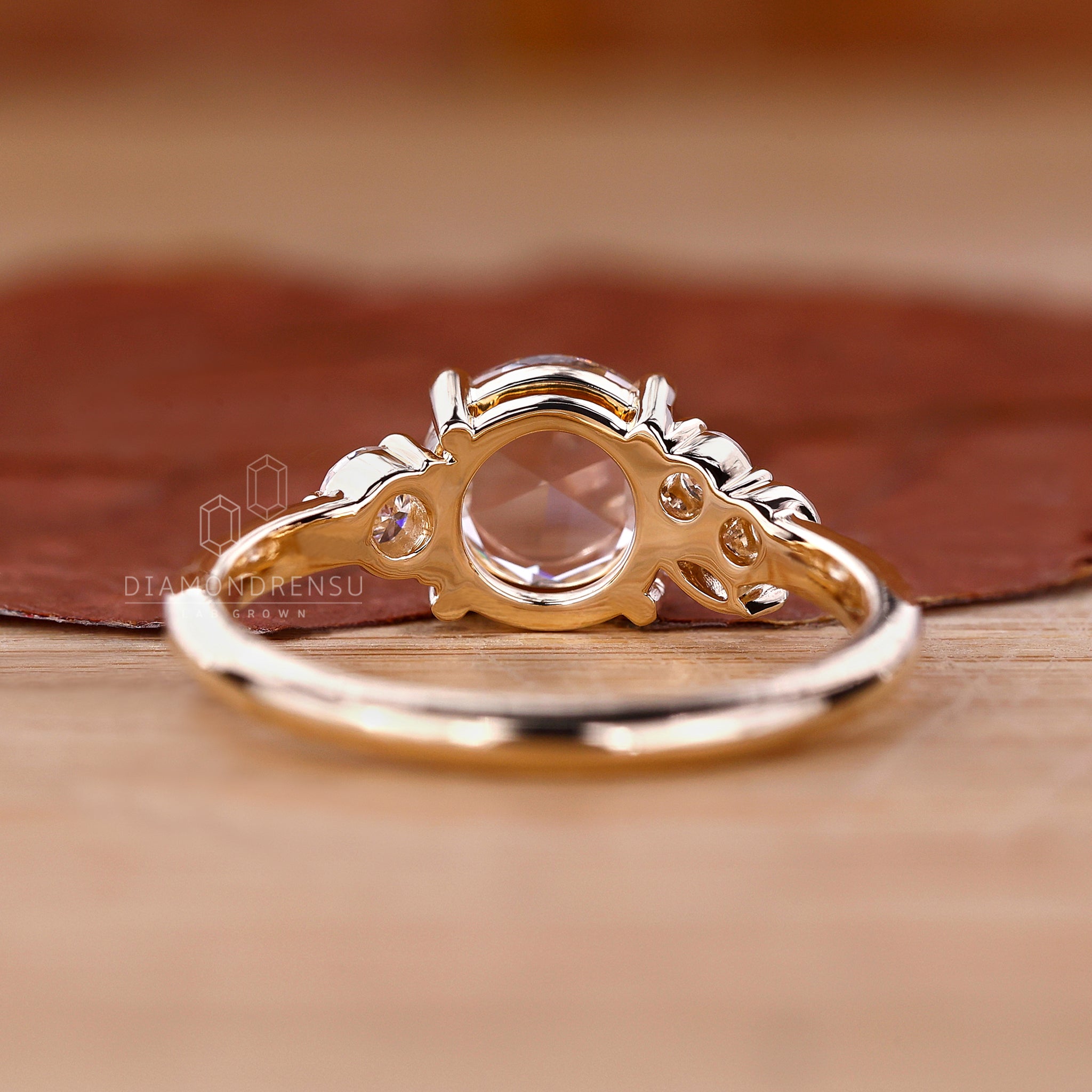 Marquise diamond ring is added with round rose cut style.
