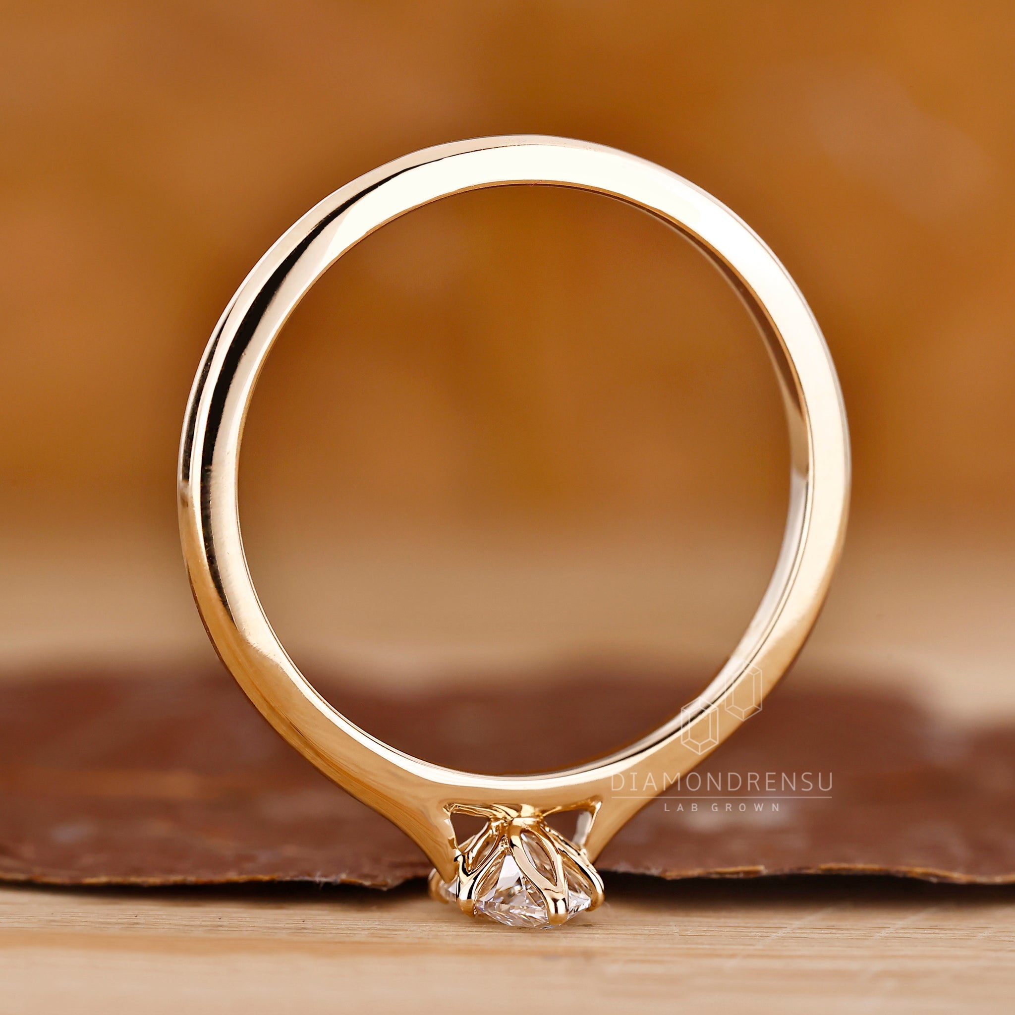 6 prong claw setting holding a marquise diamond.
