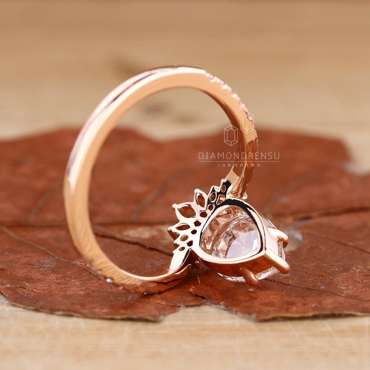 Pear Shaped Engagement Ring set with a beautiful handmade jewelry piece.