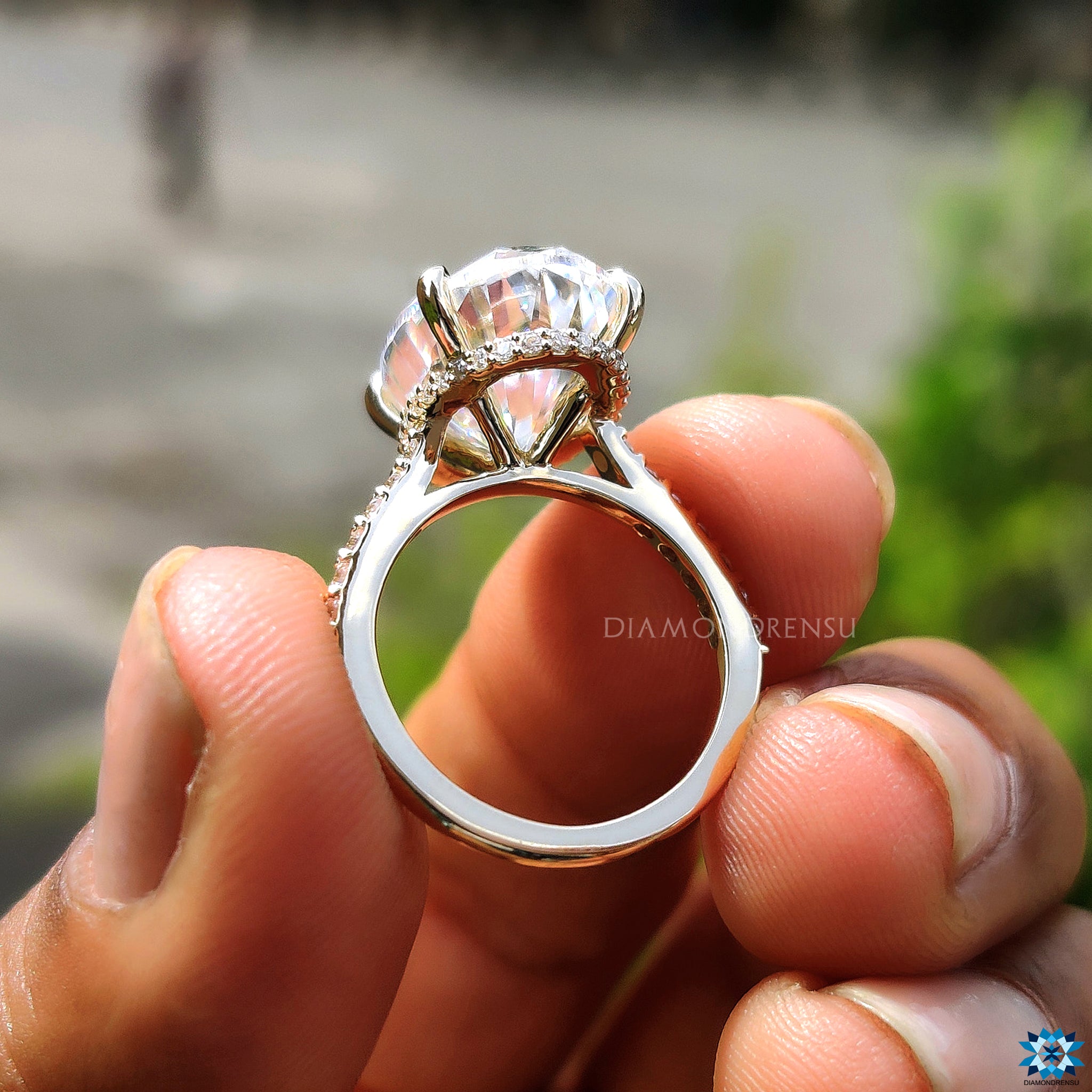 Elegant handmade jewelry featuring 7.70ct oval moissanite and hidden halo finish.
