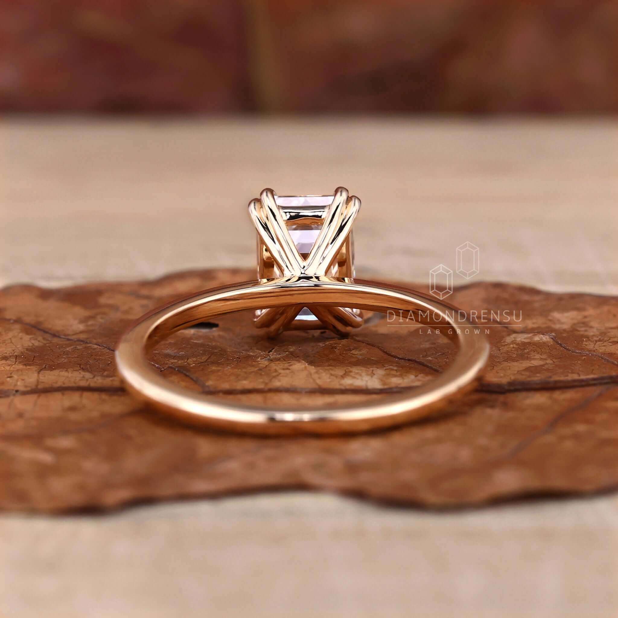 Solitaire engagement ring emerald cut, ideal for special occasions.