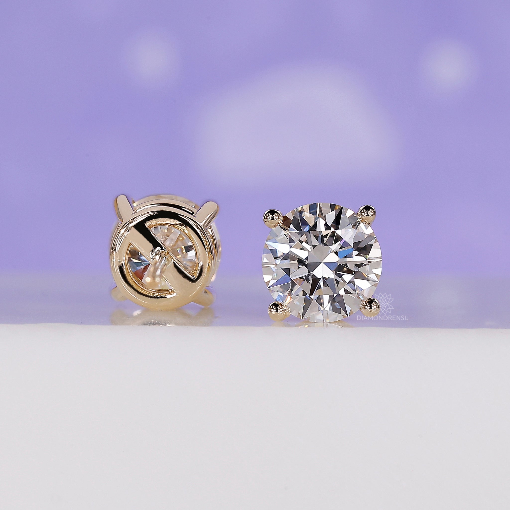 Minimalist diamond stud earrings.