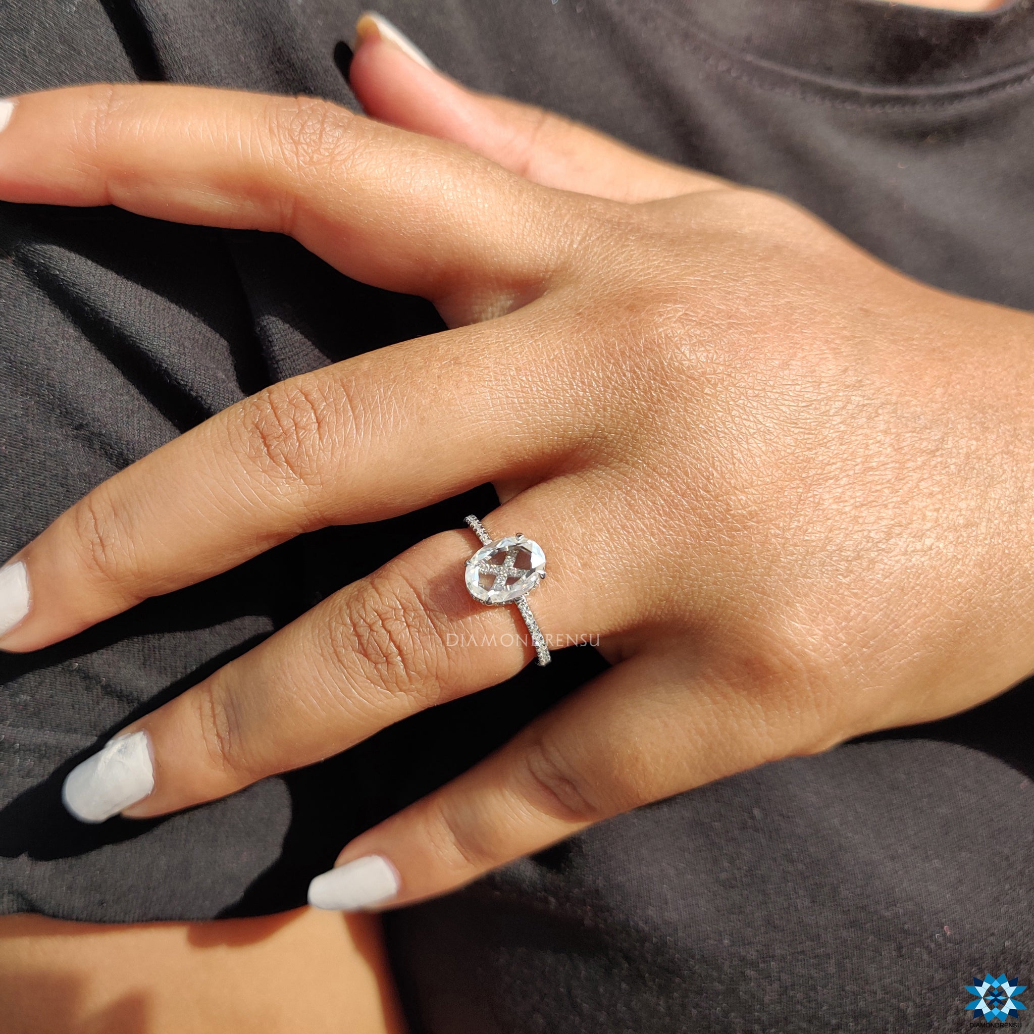 Round cut pave band with 4 claw prong setting on oval rose cut ring.
