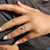 Round cut pave band with 4 claw prong setting on oval rose cut ring.
