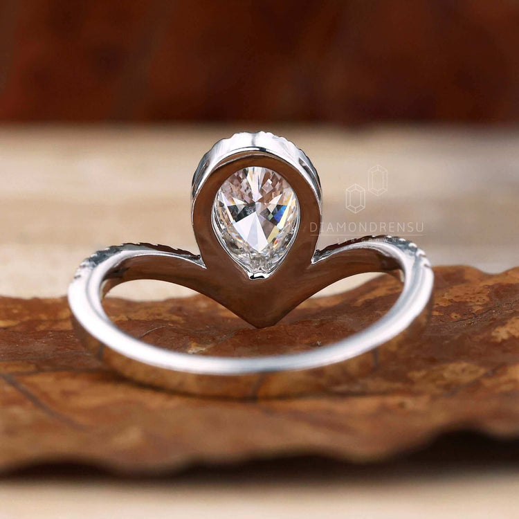 Unique engagement ring with pave set diamonds, designed for those seeking timeless beauty and elegance.
