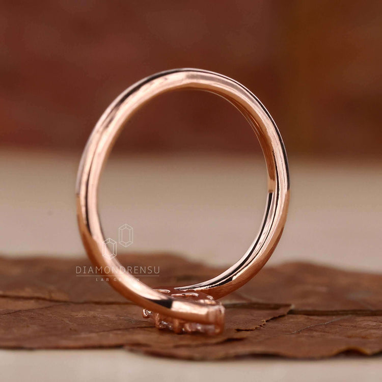 Pear diamond engagement ring set in rose gold for a timeless and romantic design.
