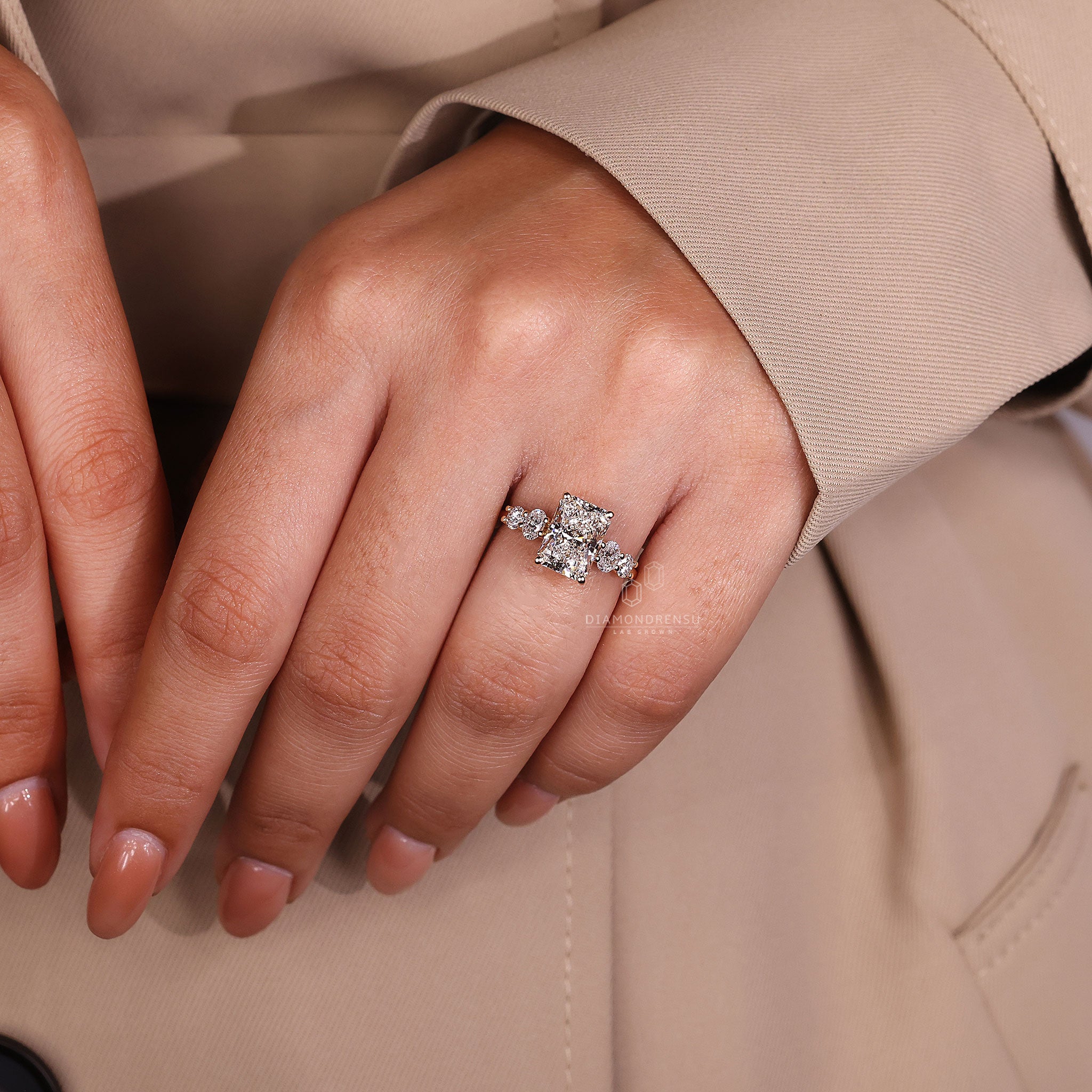 UK engagement ring is styled using radiant and round cuts.
