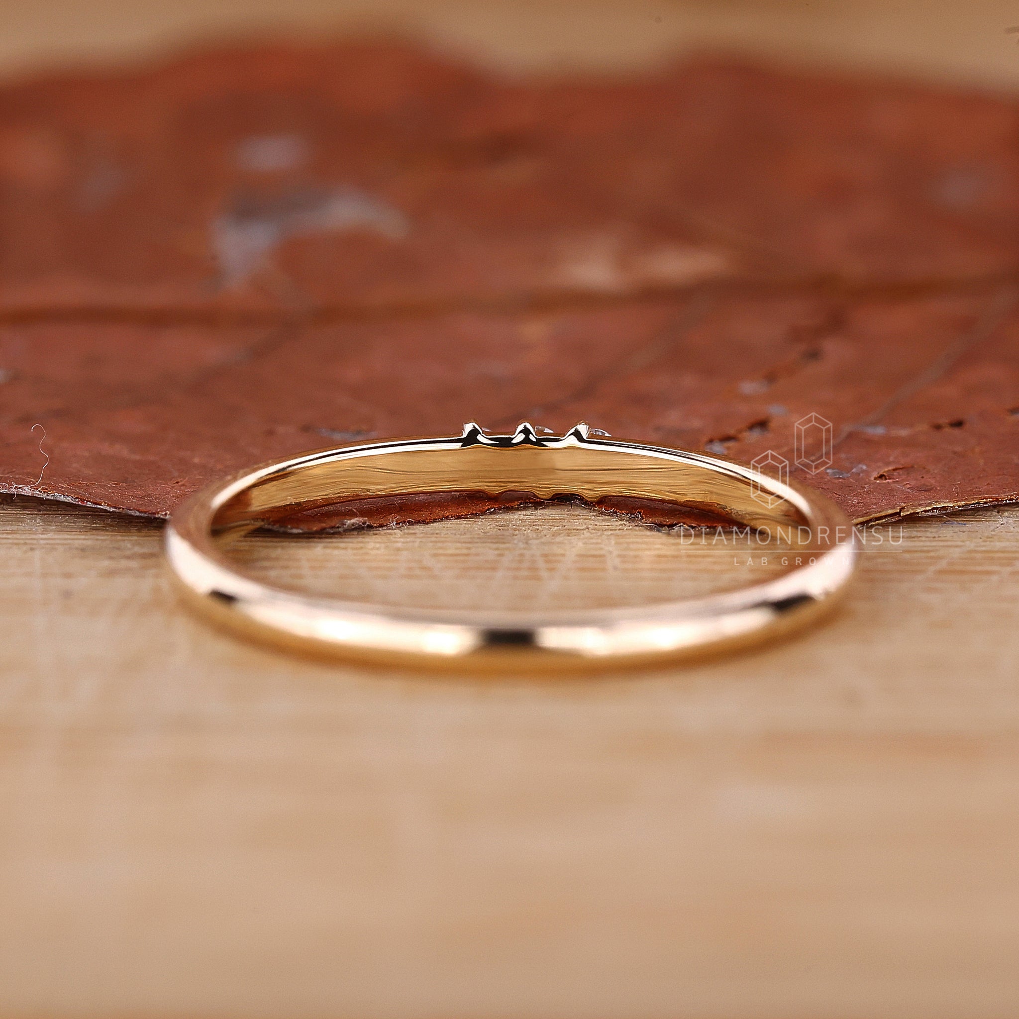 Lab grown diamond wedding band in gold.
