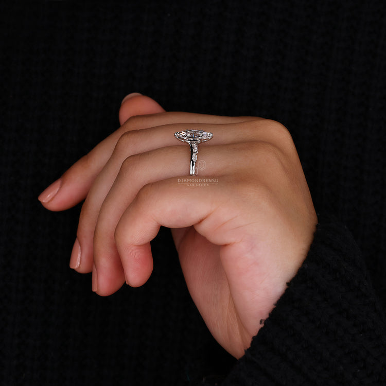 White gold ring styled as Dutch marquise diamond ring.
