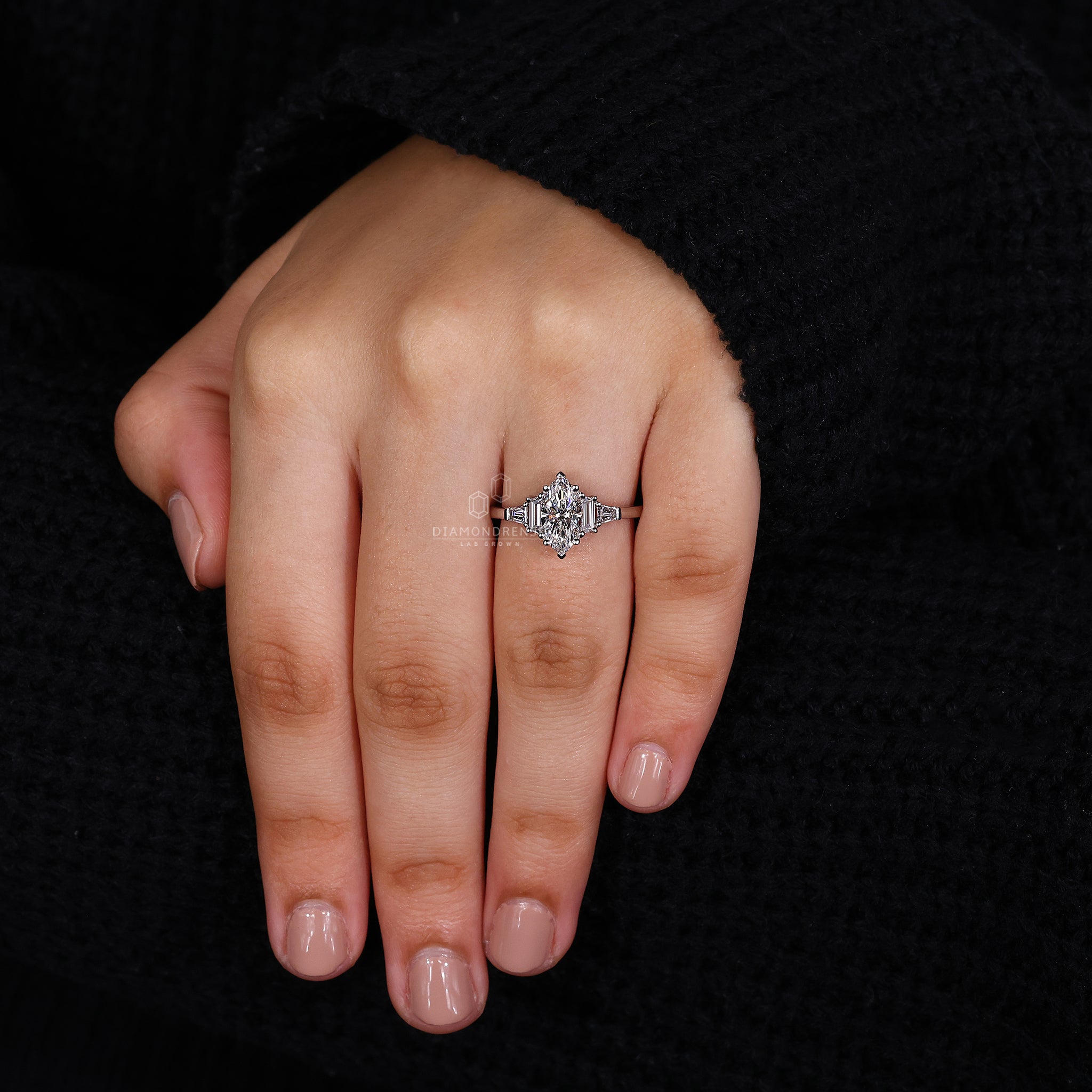 Unique engagement ring includes marquise cut and baguette diamonds together.

