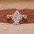 Marquise diamond bridal set with chevron wedding band in yellow gold.

