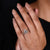 Halo engagement ring with marquise shape outline shank in yellow gold bridal set.
