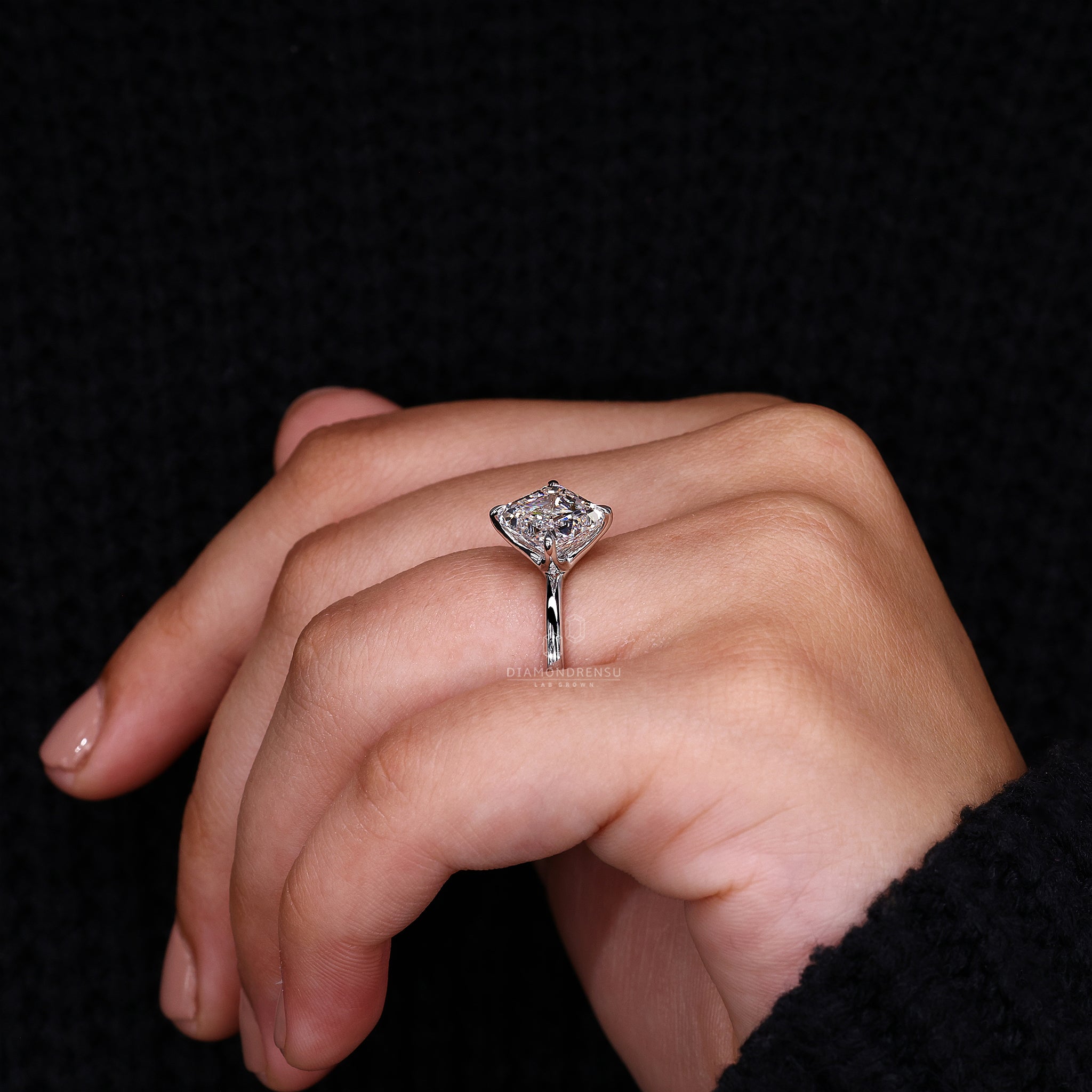 Unique engagement ring is made using asscher cut diamond and prong style.
