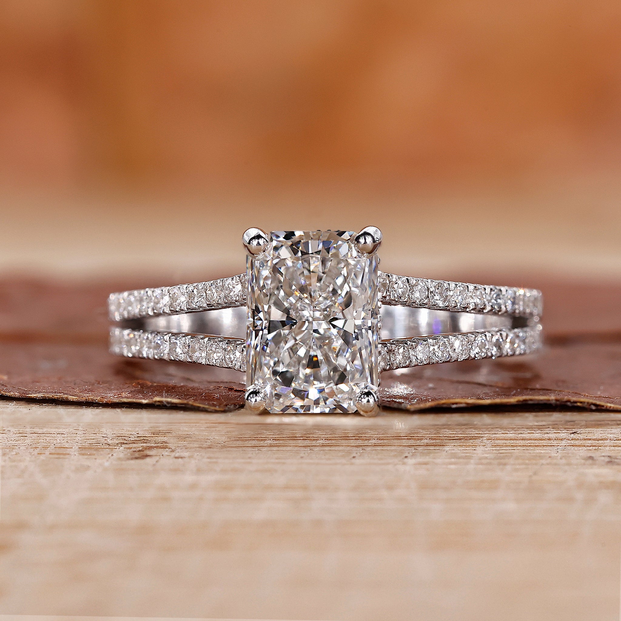 Radiant cut engagement ring with a hidden halo design.
