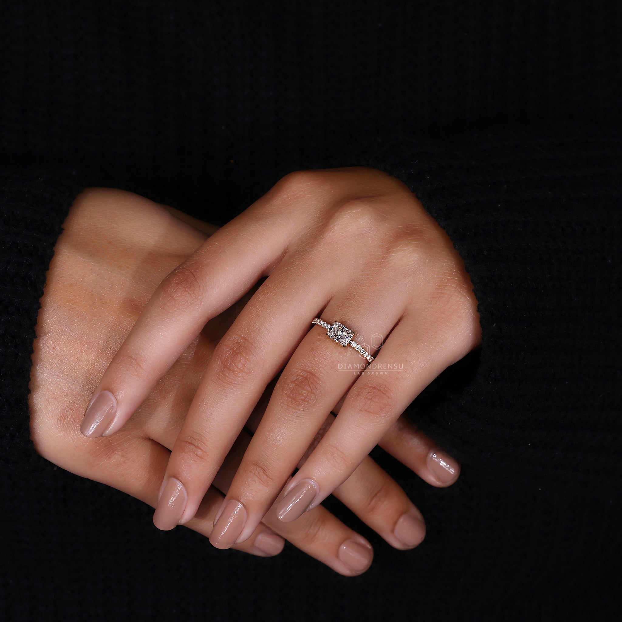 Custom engagement ring with four claw prong set and prong set ring design.
