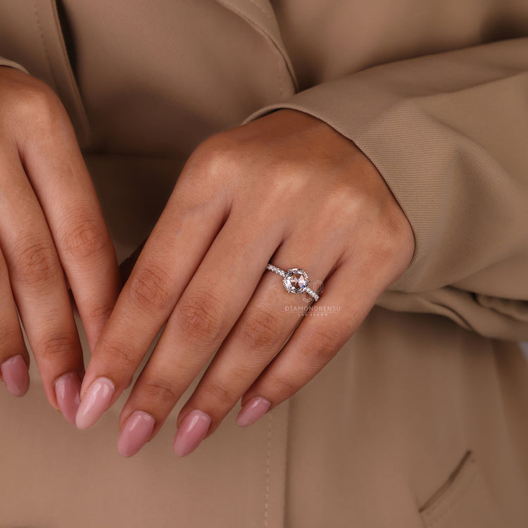 Round cut pave ring with 6 prong claw setting and lab grown diamond.
