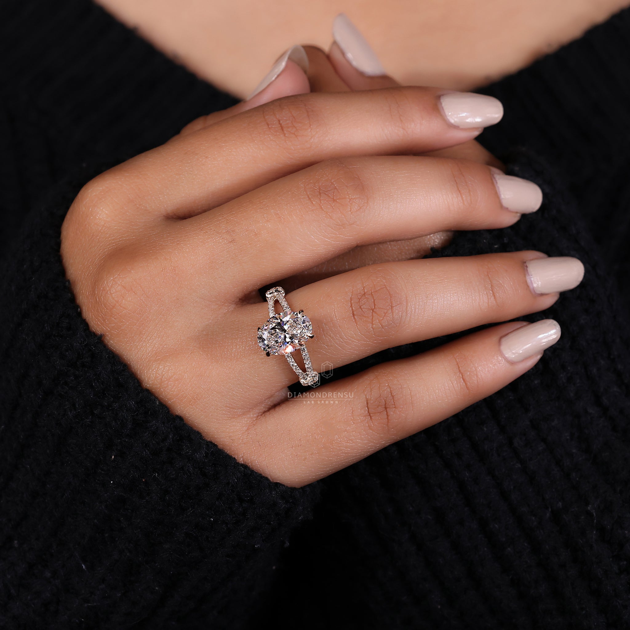 Yellow gold ring with 4 claw prong set engagement ring details.
