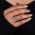 Yellow gold ring with 4 claw prong set engagement ring details.

