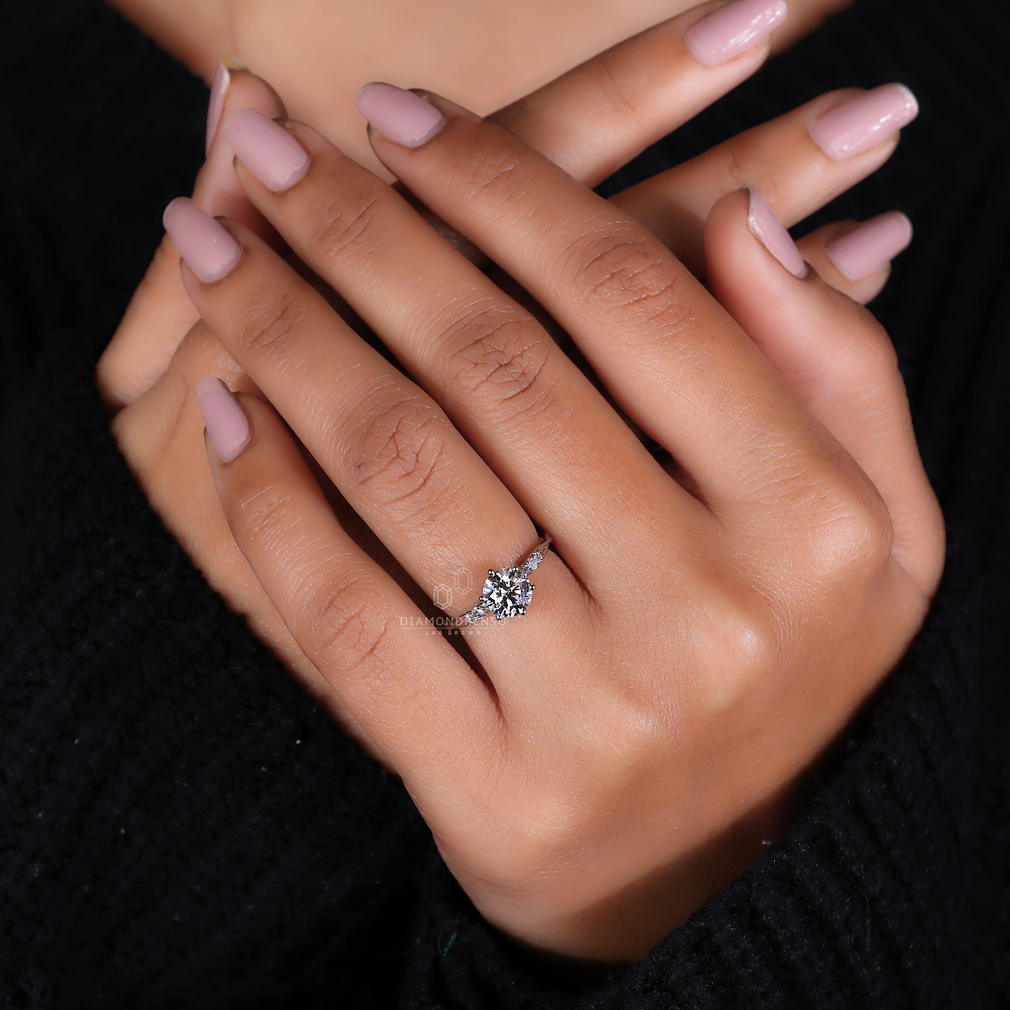 Twisted pave ring with six prong ring setting in white gold.
