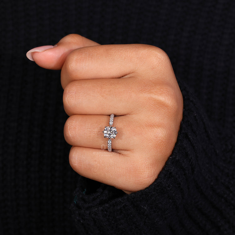 White gold ring with cushion old mine cut and pave diamond ring style.
