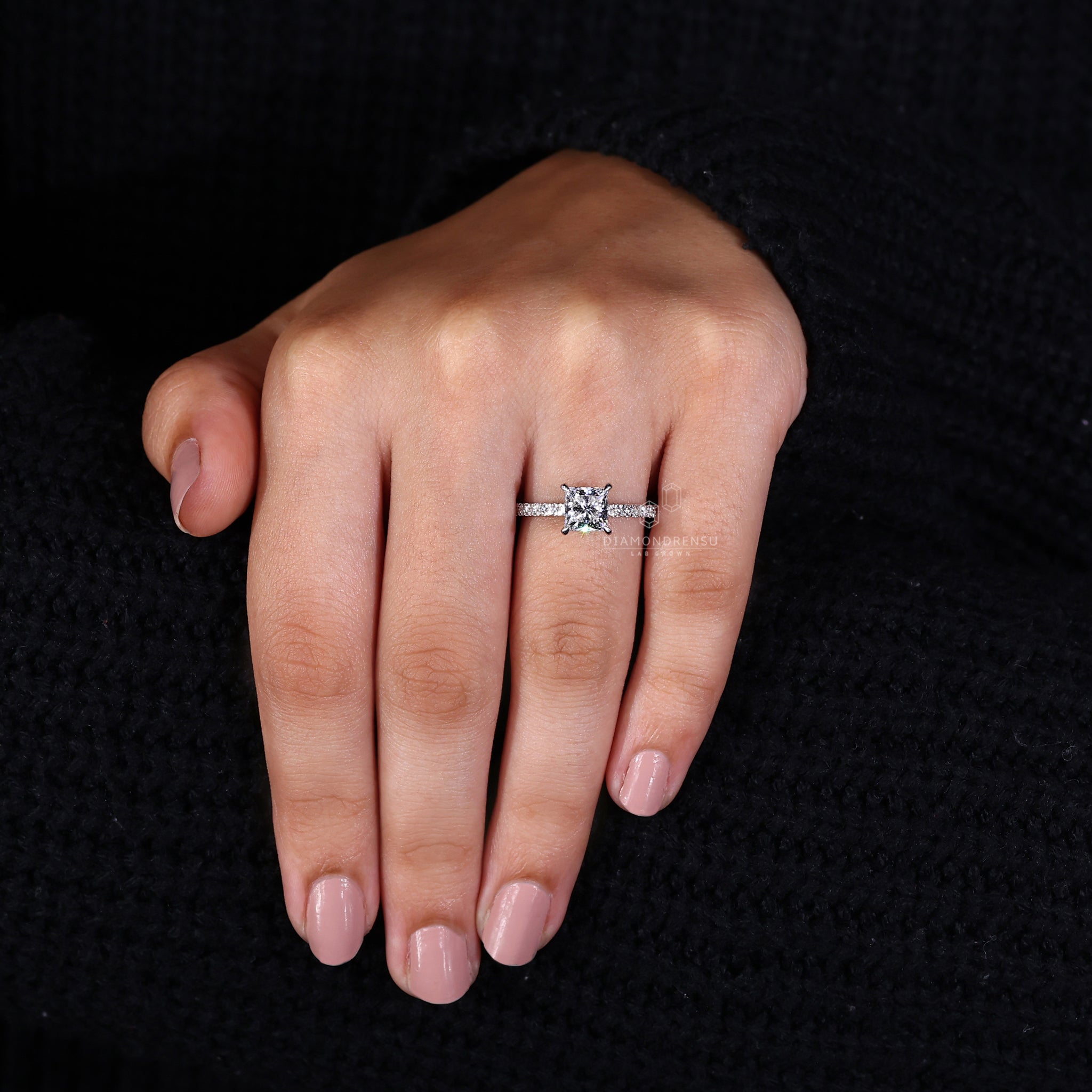 White gold diamond ring with 4 prong claw setting.
