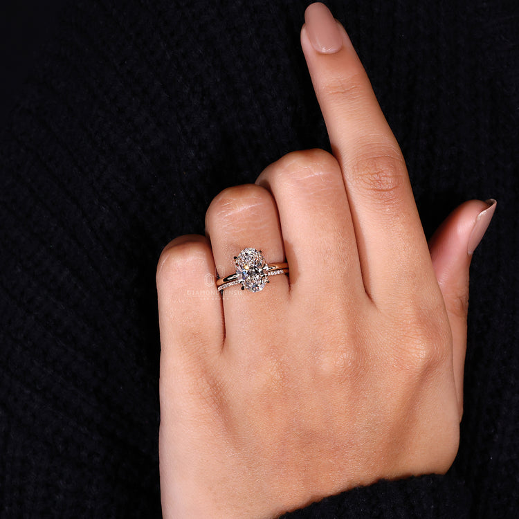 Minimalist diamond band in yellow gold bridal set with solitaire engagement ring.
