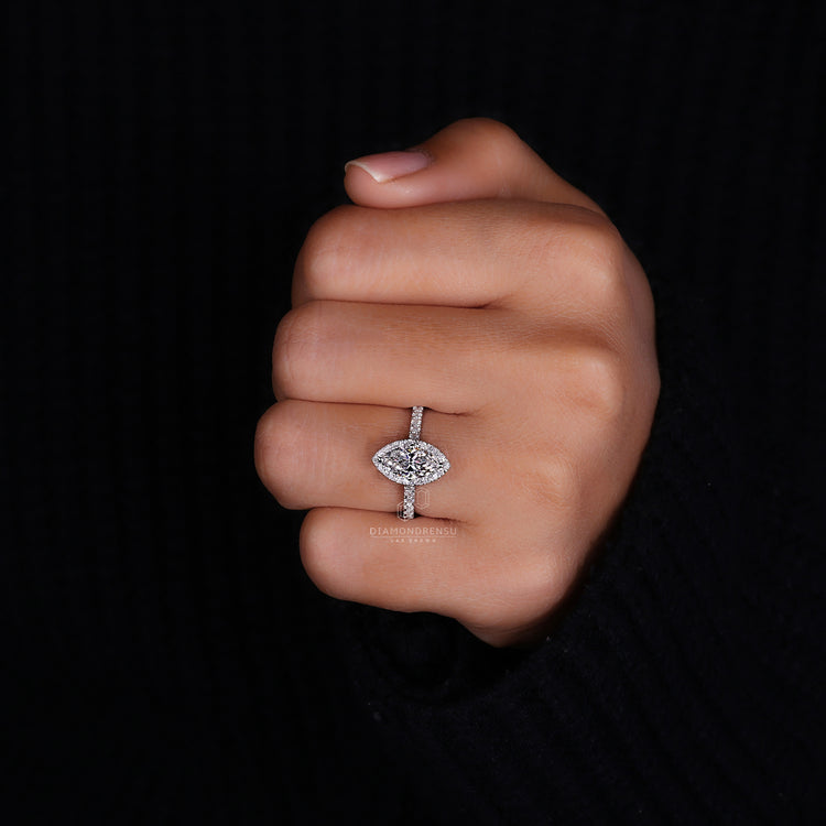 Round cut halo ring with pave diamond band.
