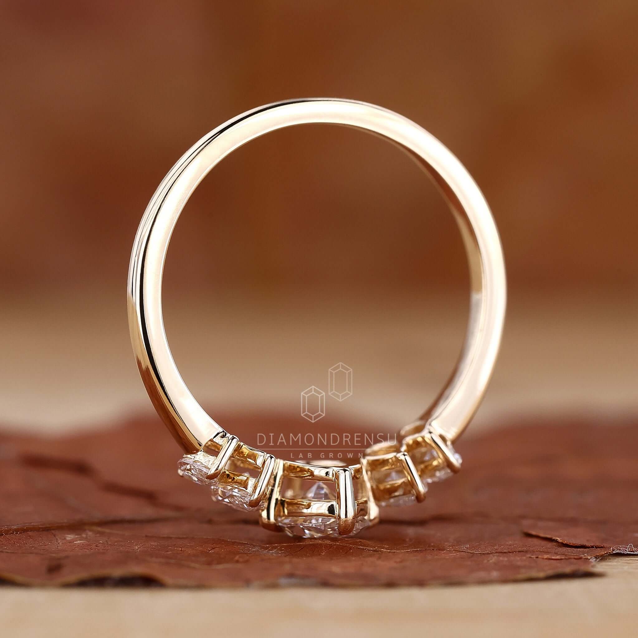 Gold oval ring showcasing a radiant diamond in a luxurious setting.