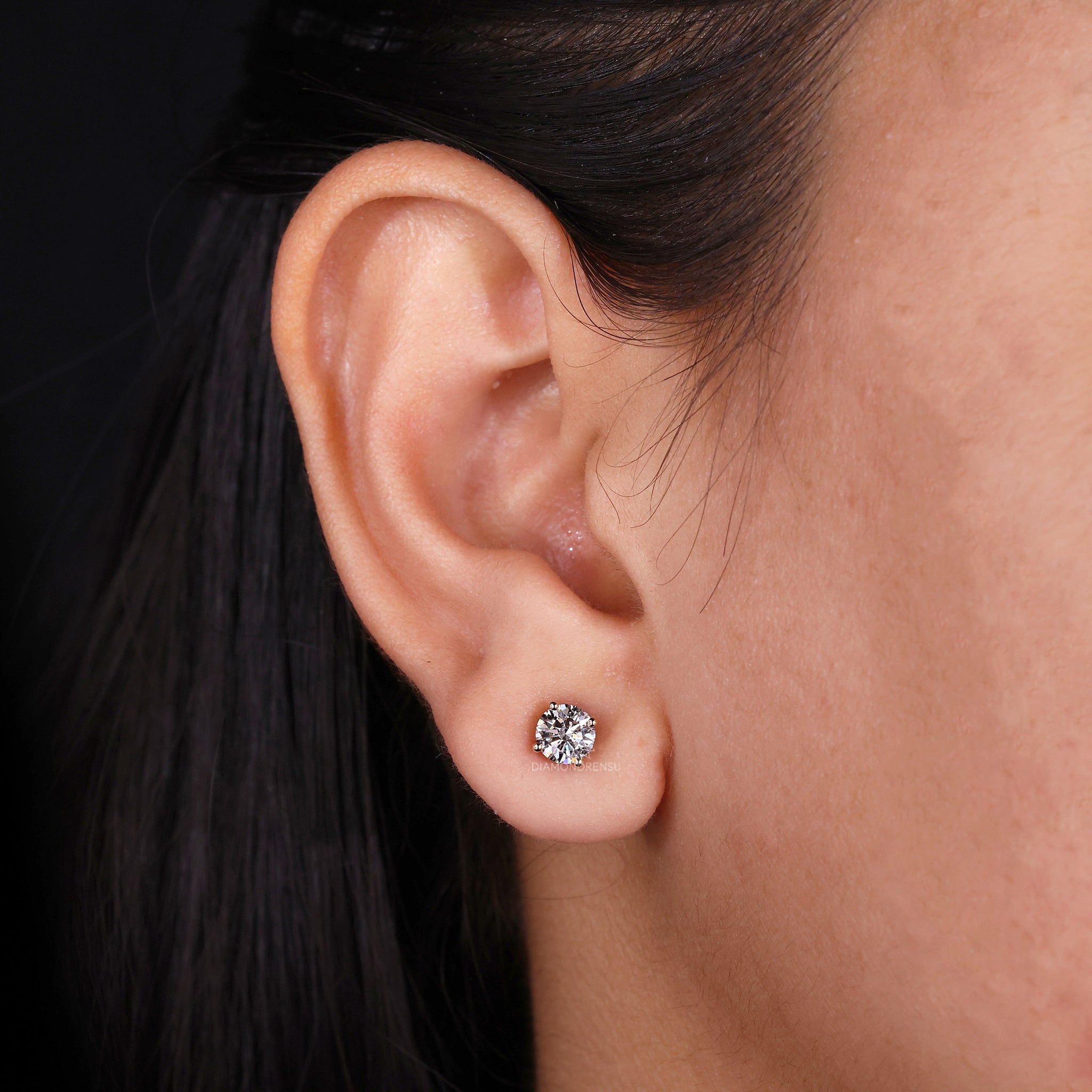 Handmade yellow gold round cut stud diamond earrings.
