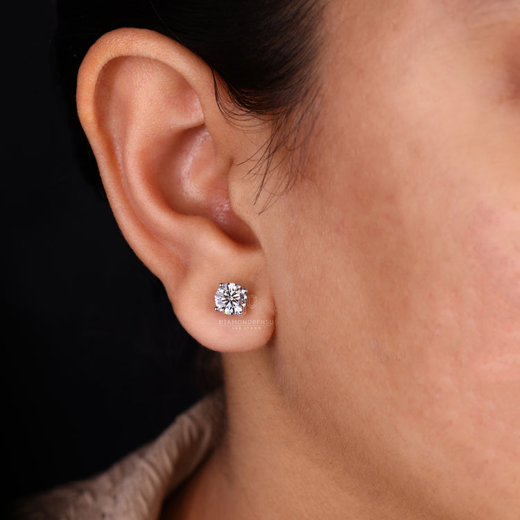 Push back diamond earrings with 4 prong setting.