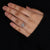 Hidden halo engagement ring with pave diamond ring and cushion centre.
