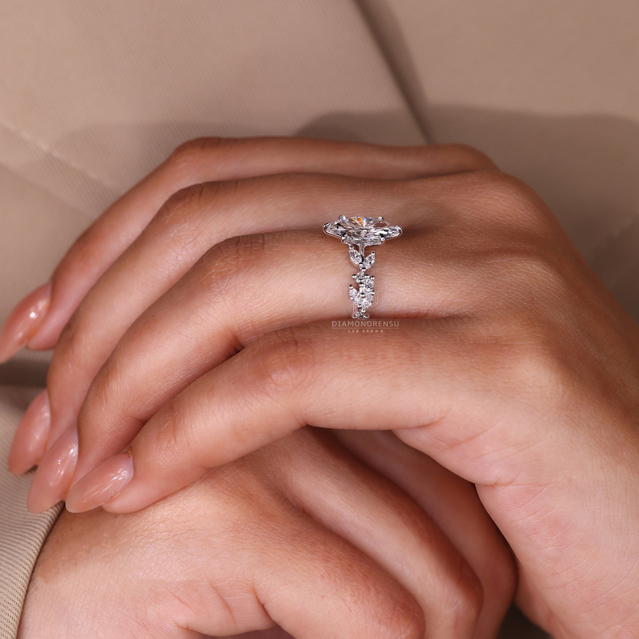 White gold ring with IGI certified marquise center and pave setting.
