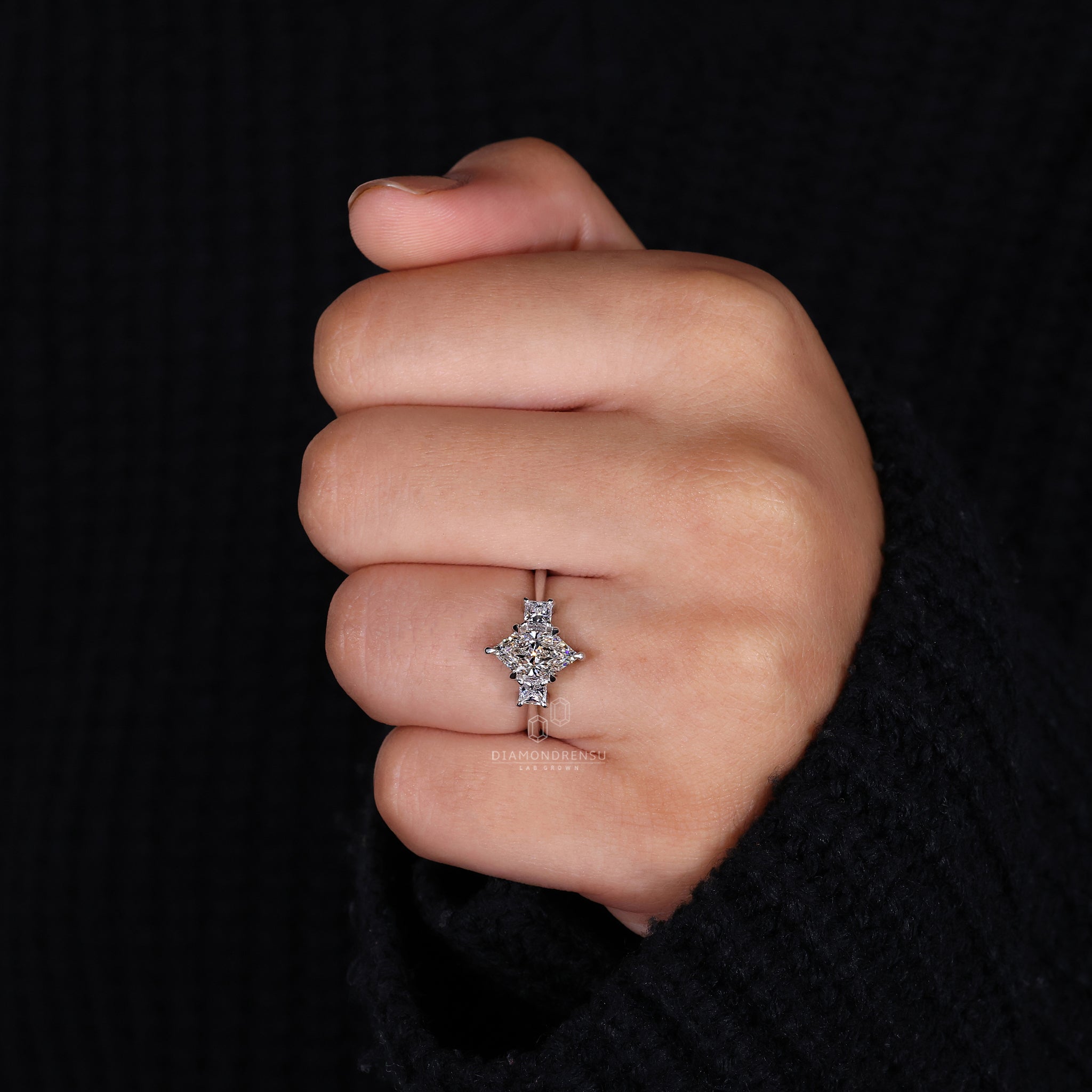 UK engagement ring made with princess cut side stones.
