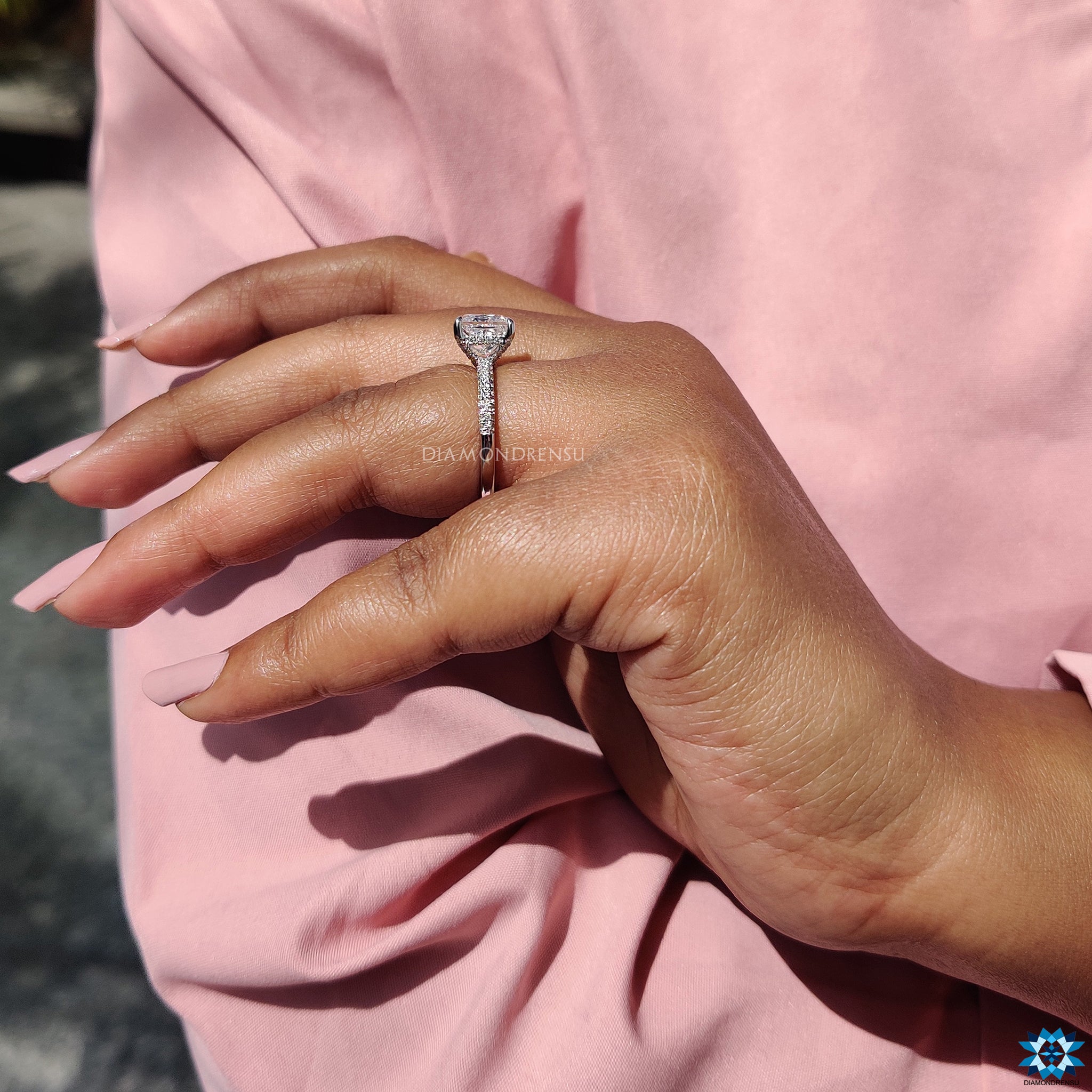 Hidden accent ring in white gold with princess cut moissanite.
