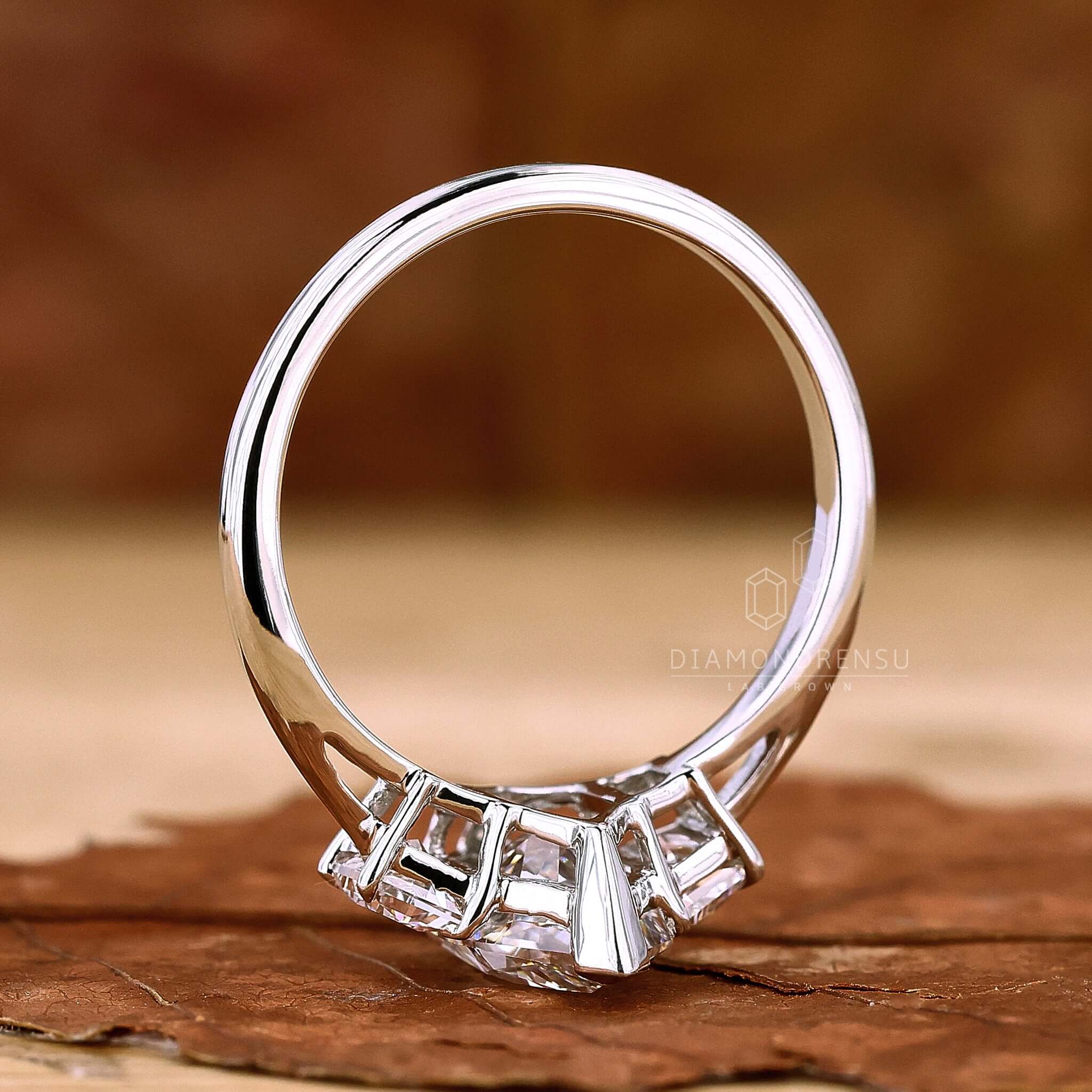 Trapezoid Side Stone Engagement Ring with sleek trapezoid diamonds framing the central stone for a bold statement.