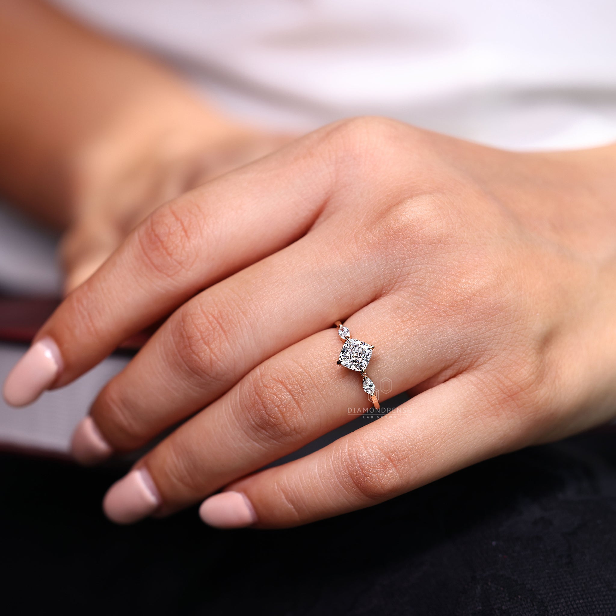 Marquise side stone ring adding graceful detail.
