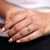 Marquise side stone ring adding graceful detail.
