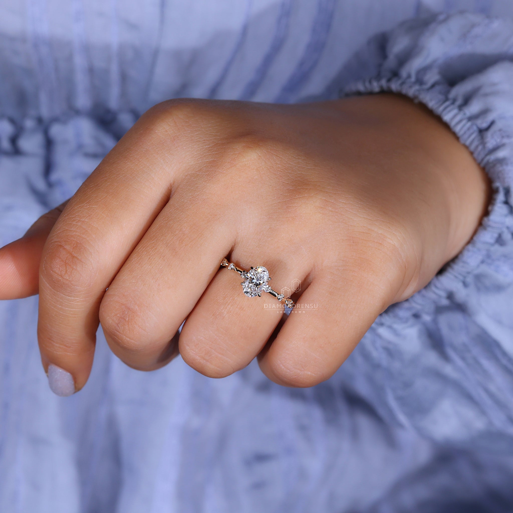 Diamondrensu UK ring with an oval diamond and hidden halo.